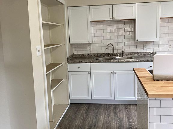 kitchen pantry shelves on left\
island on right