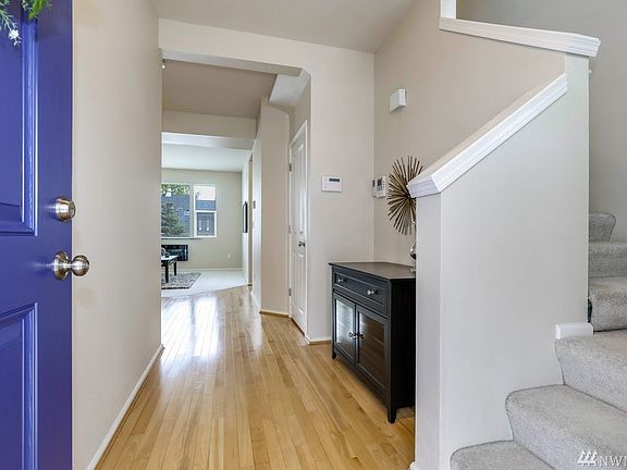 Inviting entry area with large coat/storage closet.