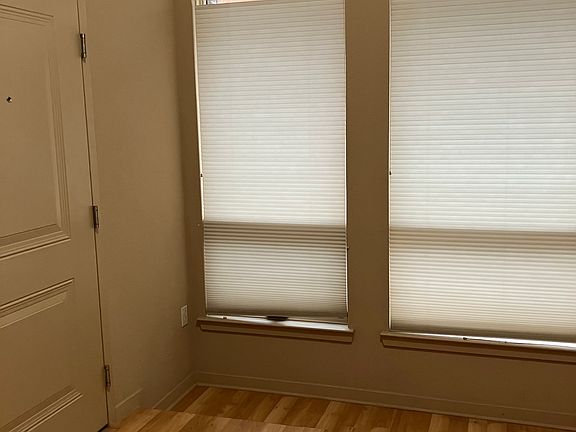 Main area with doorway to hallway with security access