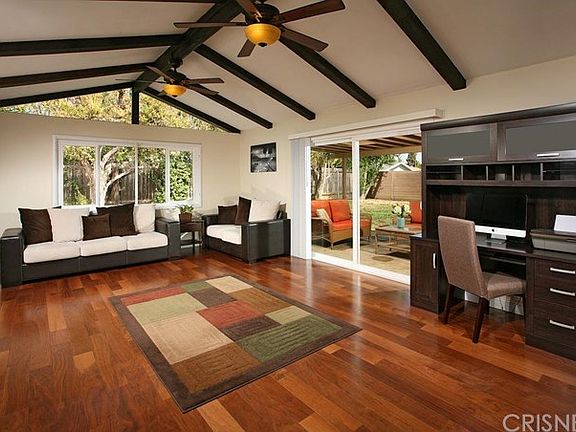 The expansive bonus/ family room is drenched in na