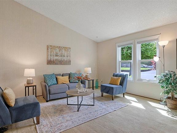 Open living room with vaulted ceiling.