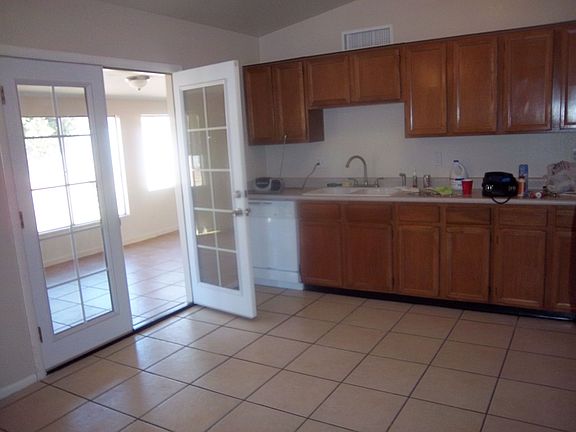 Leads to storage area/AZ room