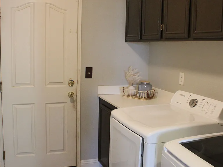 Dedicated indoor laundry room with washer and gas dryer hookups