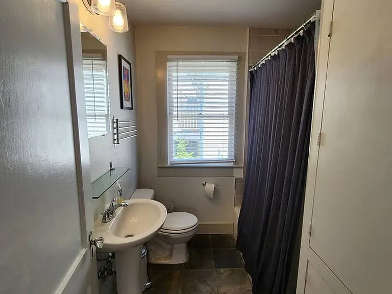 E 11th 1/2 St — Photo 13
