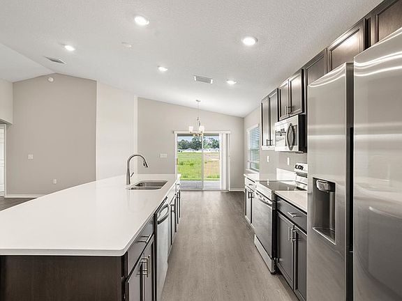 Dine at the island or the sunny adjacent dining cafe.