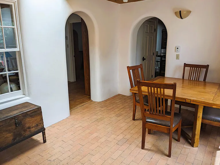 Expandable dining table and radiant floor heating in the sunroom