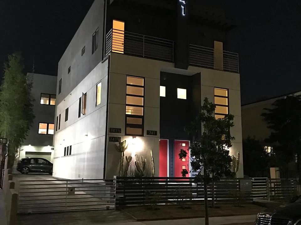 Nigh Time View of Facade and Entrance Driveway