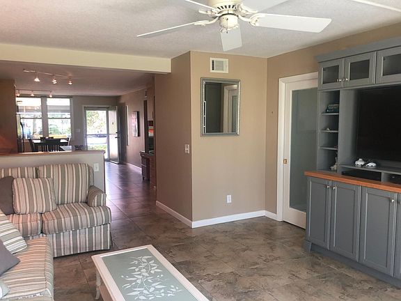 Gathering Room with Custom Entertainment Center; pocket door with beaded frosted glass insert