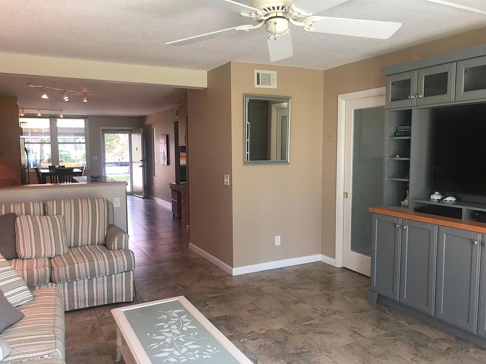 Gathering Room with Custom Entertainment Center; pocket door with beaded frosted glass insert