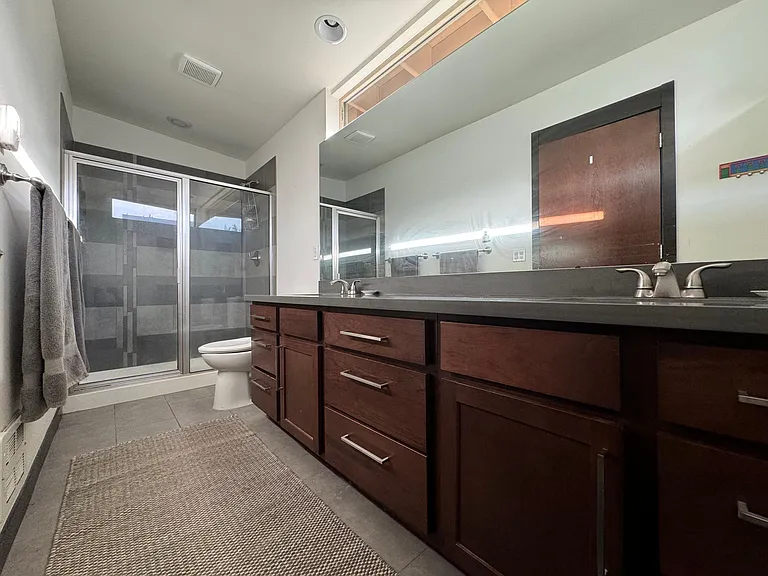 3rd Floor: Primary Bathroom. Double sink and a walk in shower.