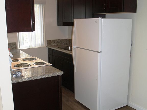 Kitchen / New cabinets, oven, refrigerator, wood plank floor