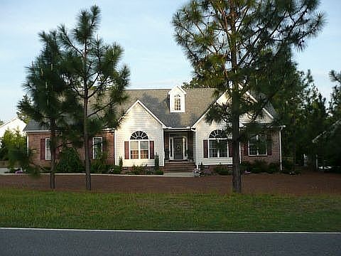 Transitional with side loading garage