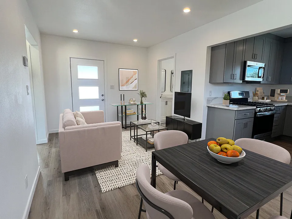 Cozy living and dining area designed with open concept in mind next to the kitchen.