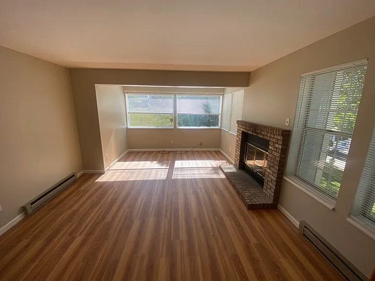 Living room with wood burning fireplace