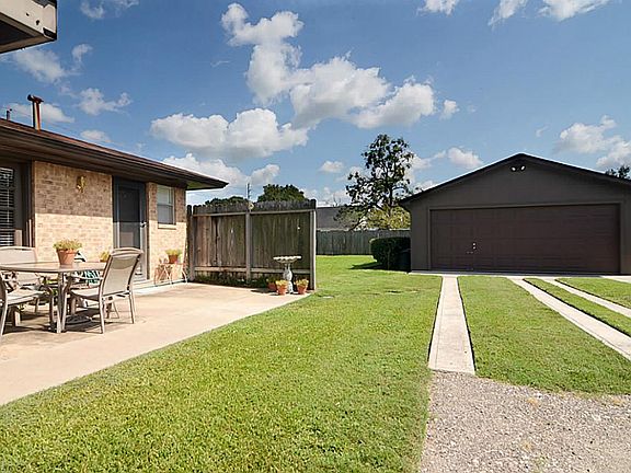 A better look at the rear patio and garage.