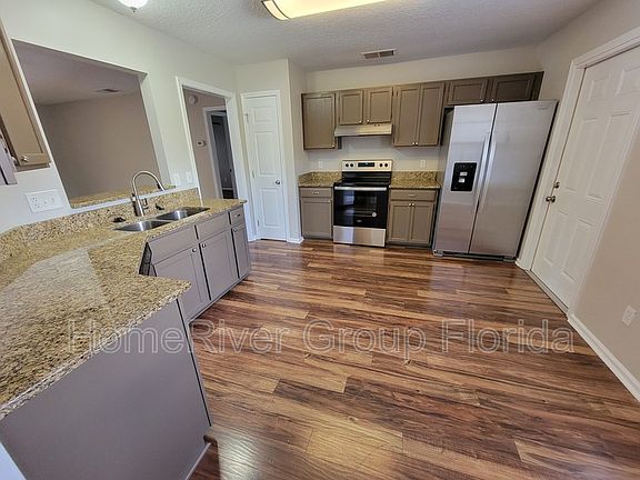 5th image of 8154 N Settlers Landing Trl