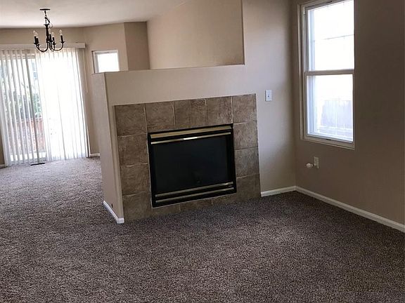 Large living room with adjoining gas fireplace