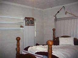 Bedroom. Owner clearing out.