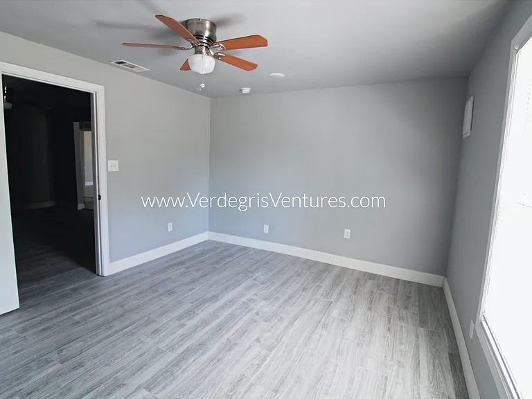 The studio or home_office/second living area includes a south_facing window, a door for privacy, and convenient access to the second bathroom. Though compact, it offers a flexible space ideal for work or additional living needs