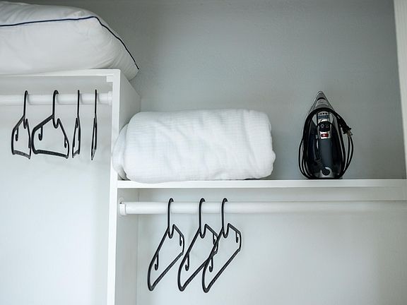 Extra blankets and pillows for your comfort. Iron and ironing board. Plastic hangers in all closets.