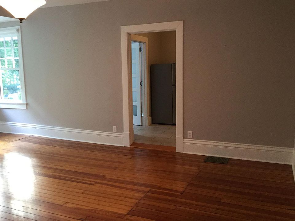 Living room and door opening to kitchen and bath