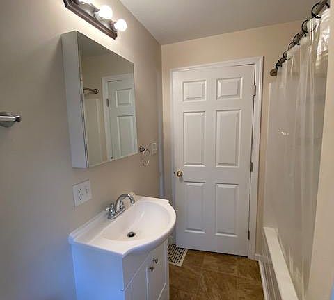 Bathroom sink and shower view