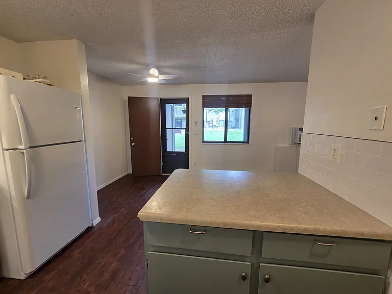 Large bar, kitchen, and easy access to green space