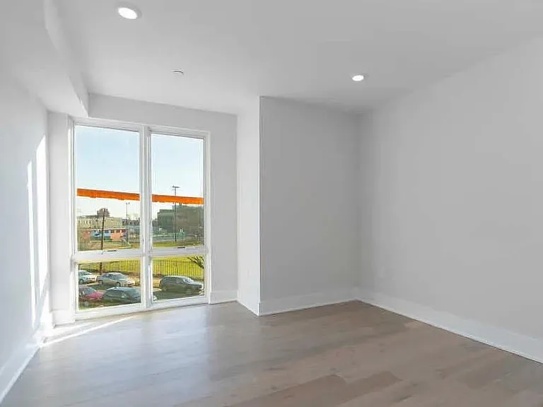 Third bedroom with plenty of sunlight.