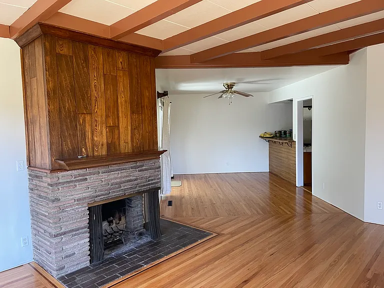 Living room open to dining area and kitchen counter