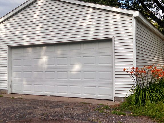 Large, two car garage. Extra space on side and rear.