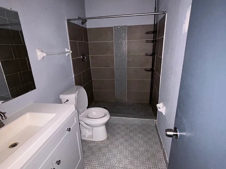 primary bathroom attached to primary bedroom