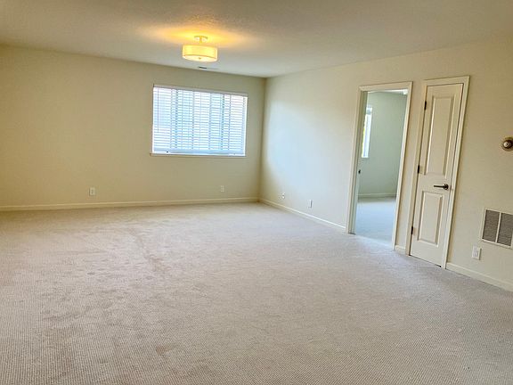 Spacious living room with lots of natural light.