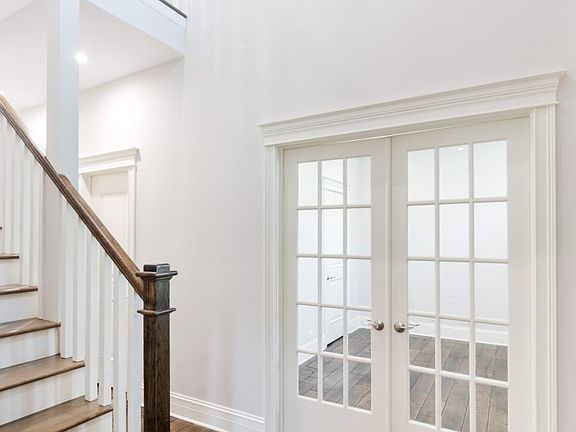 The entry is grand with gleaming hand beveled European oak floors!