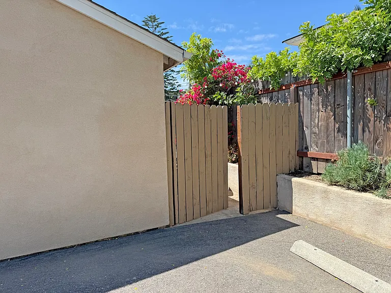 Side gate to patio / kitchen right next to parking space.