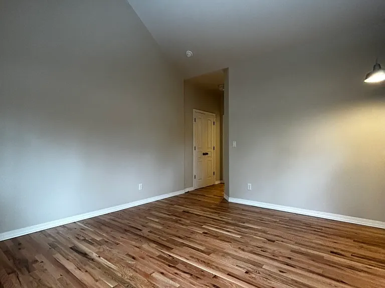 Another view of primary bedroom