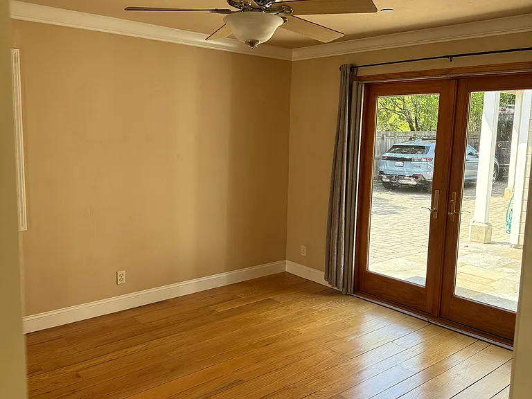 Larger bedroom with french doors