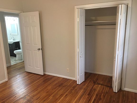 bedroom looking across hall into bathroom