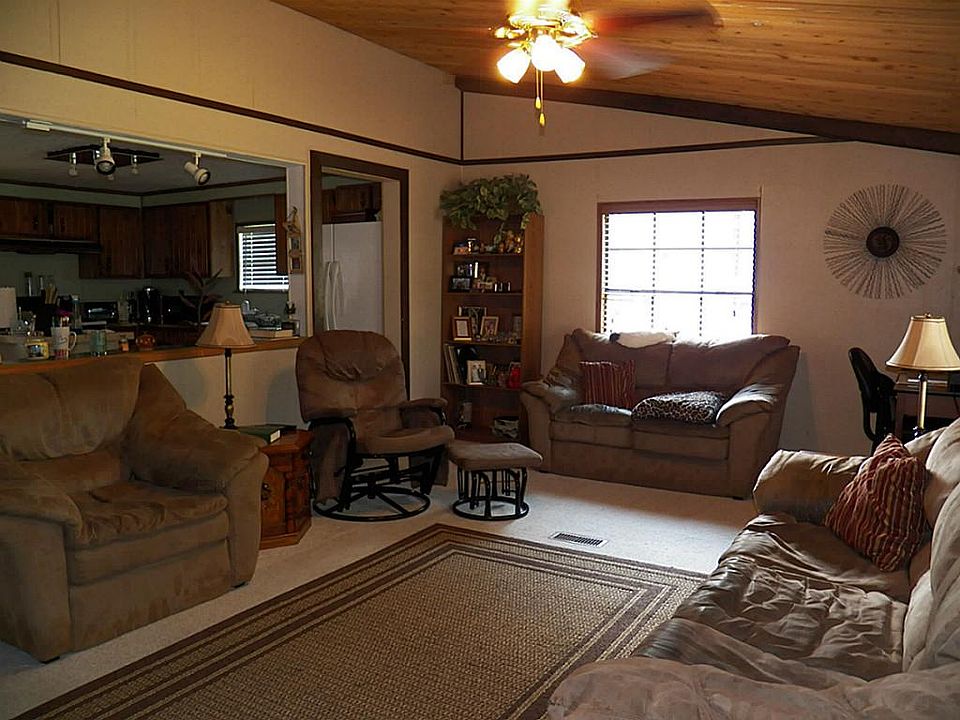 Living room opens to the kitchen/dining area.