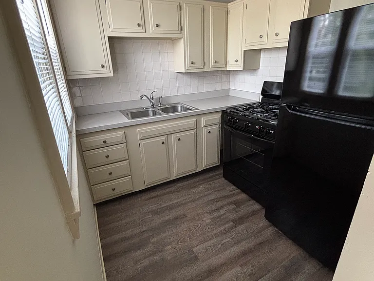 Kitchen with new gas stove and refrigerator