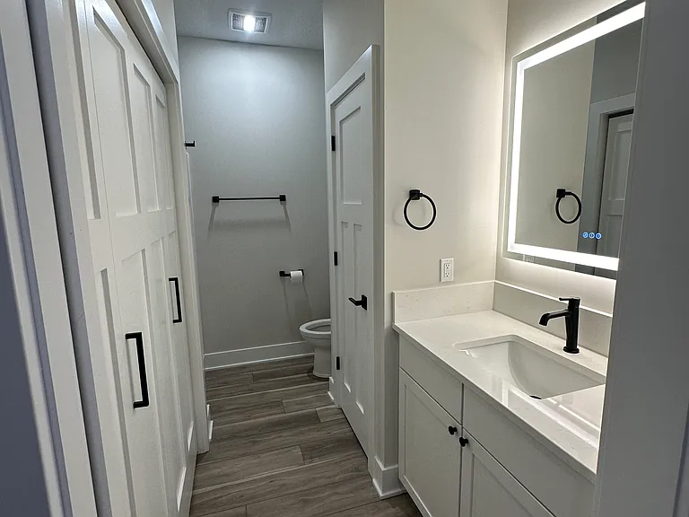 Second main floor bathroom with washer and dryer