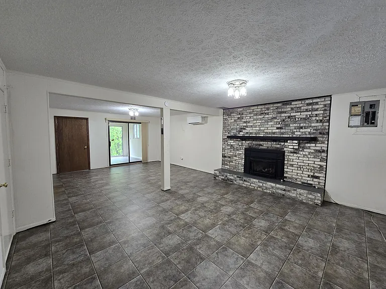 Downstairs Very Large Living Room with "Mud Room" on Back