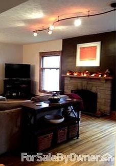 Large living room with gas log fireplace
						:
						large comfortable living room with gas log insert