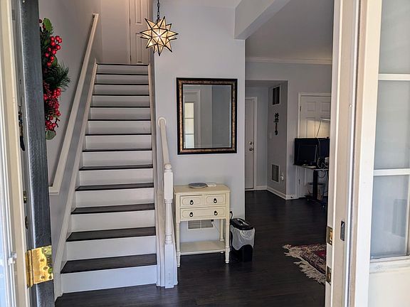 Entrance leads to the the 1st floor great room that can be used as a seating area, tv room, home office, or exercise room.