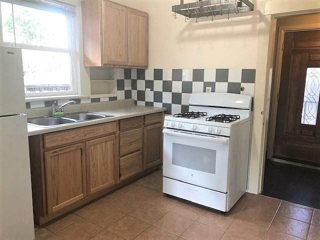 Kitchen leading to back mud room and patio.