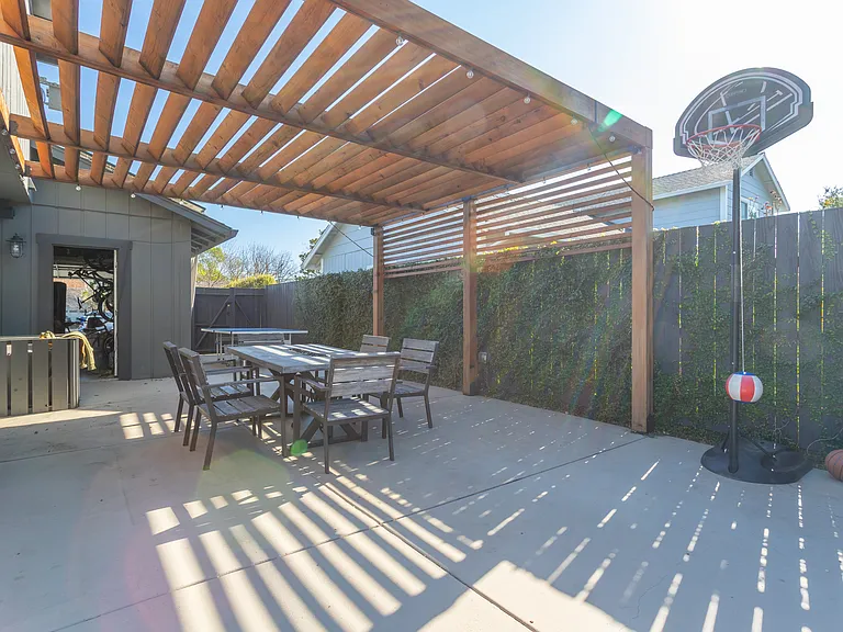 Lit entertaining area, BBQ zone, ping pong, basketball hoop