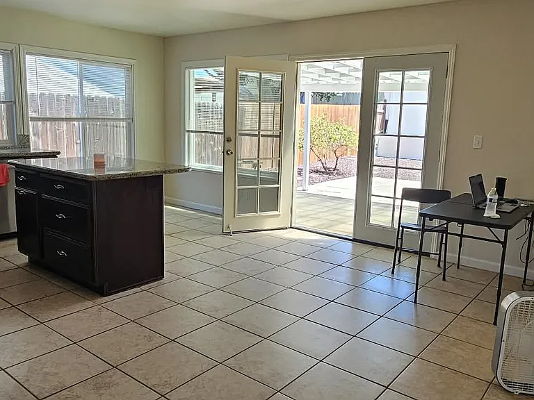 Kitchen and Dining area with french doors to the patio.