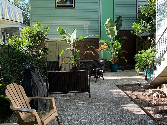 Shared courtyard / grill area (note: staircase on right hand side is back house entry point for upstairs unit)