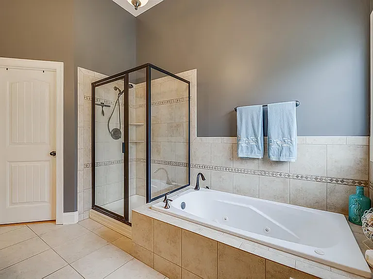 Primary Bathroom Soaking Tub and Tiled Shower
