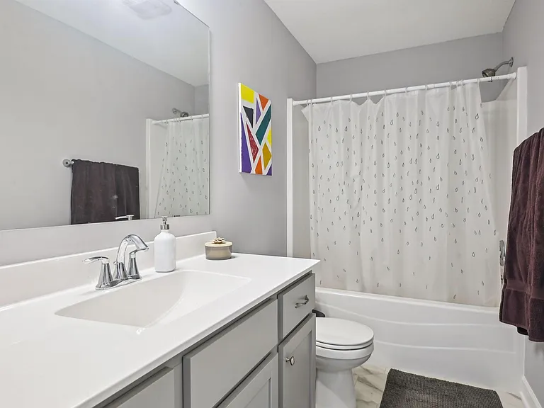 Upper level shared full bath