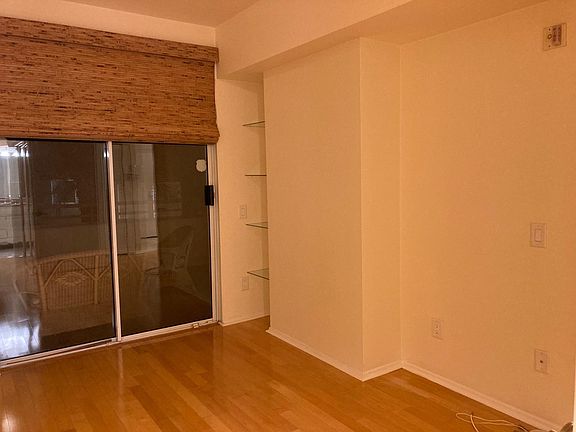 Bedroom to patio, view of glass shelves